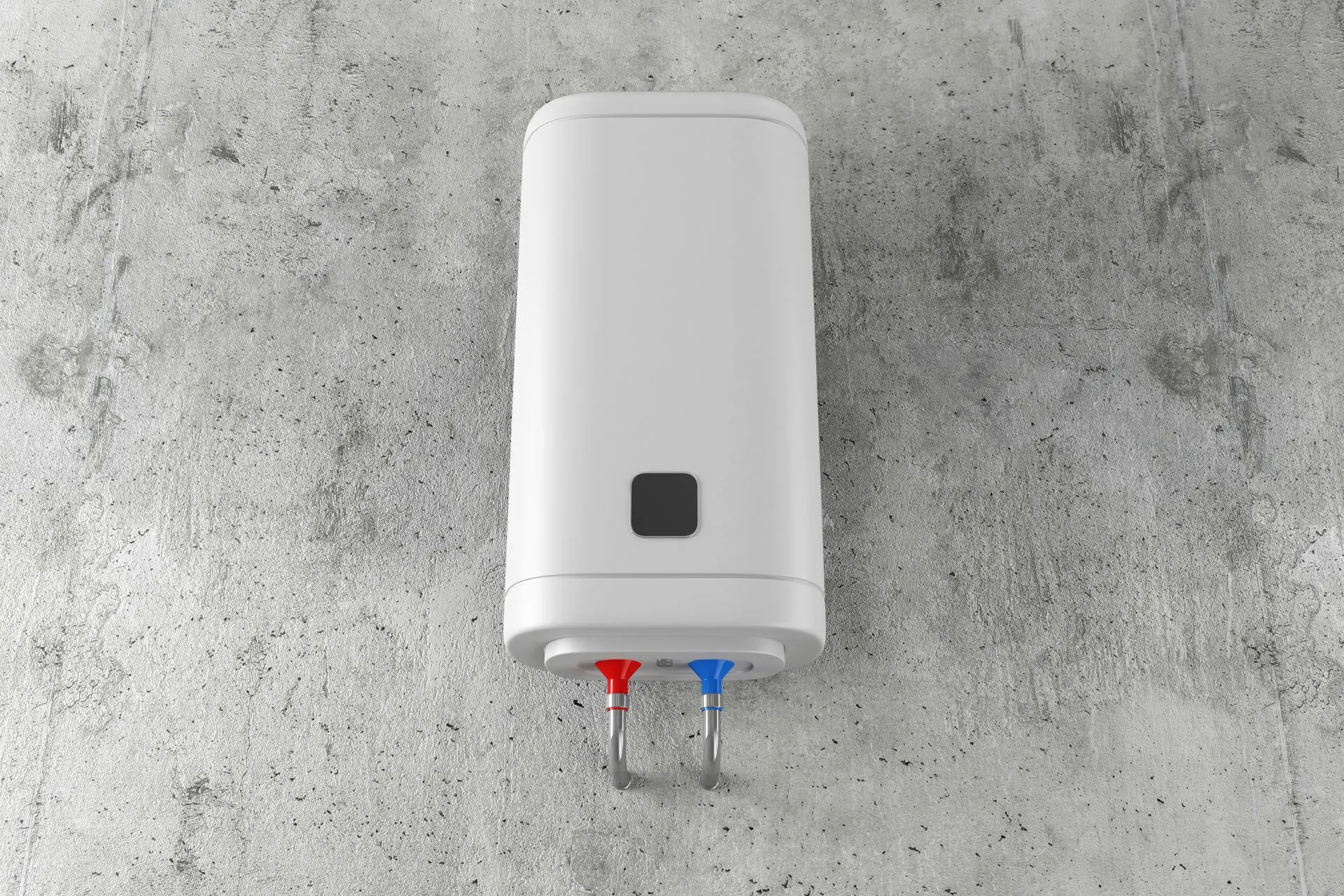A white water heater is hanging on a concrete wall.